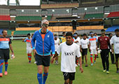 Indian Coach Wim Koevermans walks hand in hand with the Blind team members